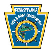 Pennsylvania Fish and Boat Commission logo showing a fish in the center of boat's wheel