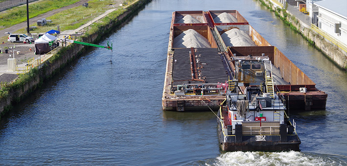 A barge traveling through the Chicago Sanitary and Ship Canal. Photo courtesy of USFWS.